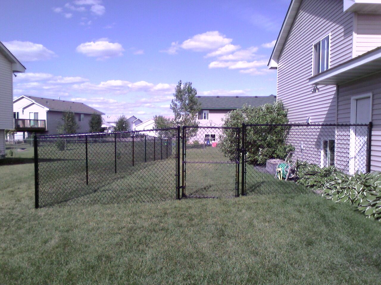 Black vinyl chain link fence installation Minnesota