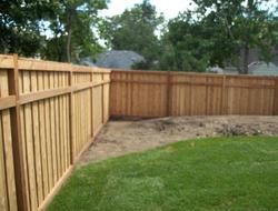 Cedar framed batten board privacy fence installation Minnesota