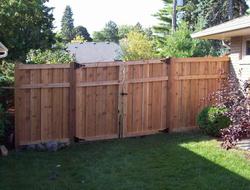 Cedar framed batten board privacy fence installation Minnesota